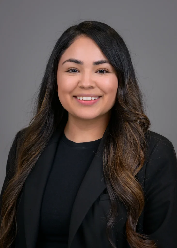 Ari in black professional attire.