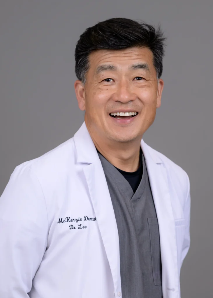 Dr. James Lee in McKenzie Dental Center’s embroidered whitecoat.