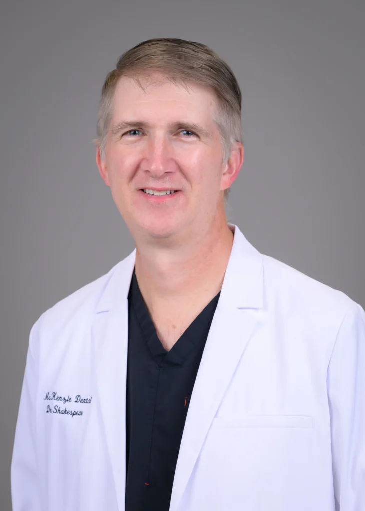 Dr. Shakespear in McKenzie Dental Center’s embroidered whitecoat.