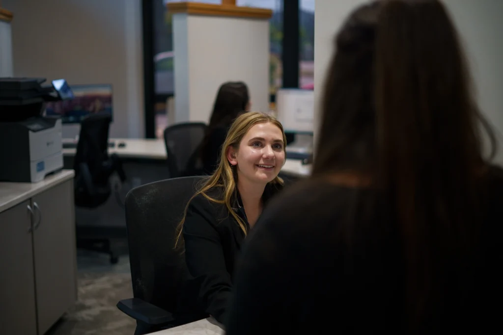 Springfield Dental Front Desk staff member looking at a dental patient