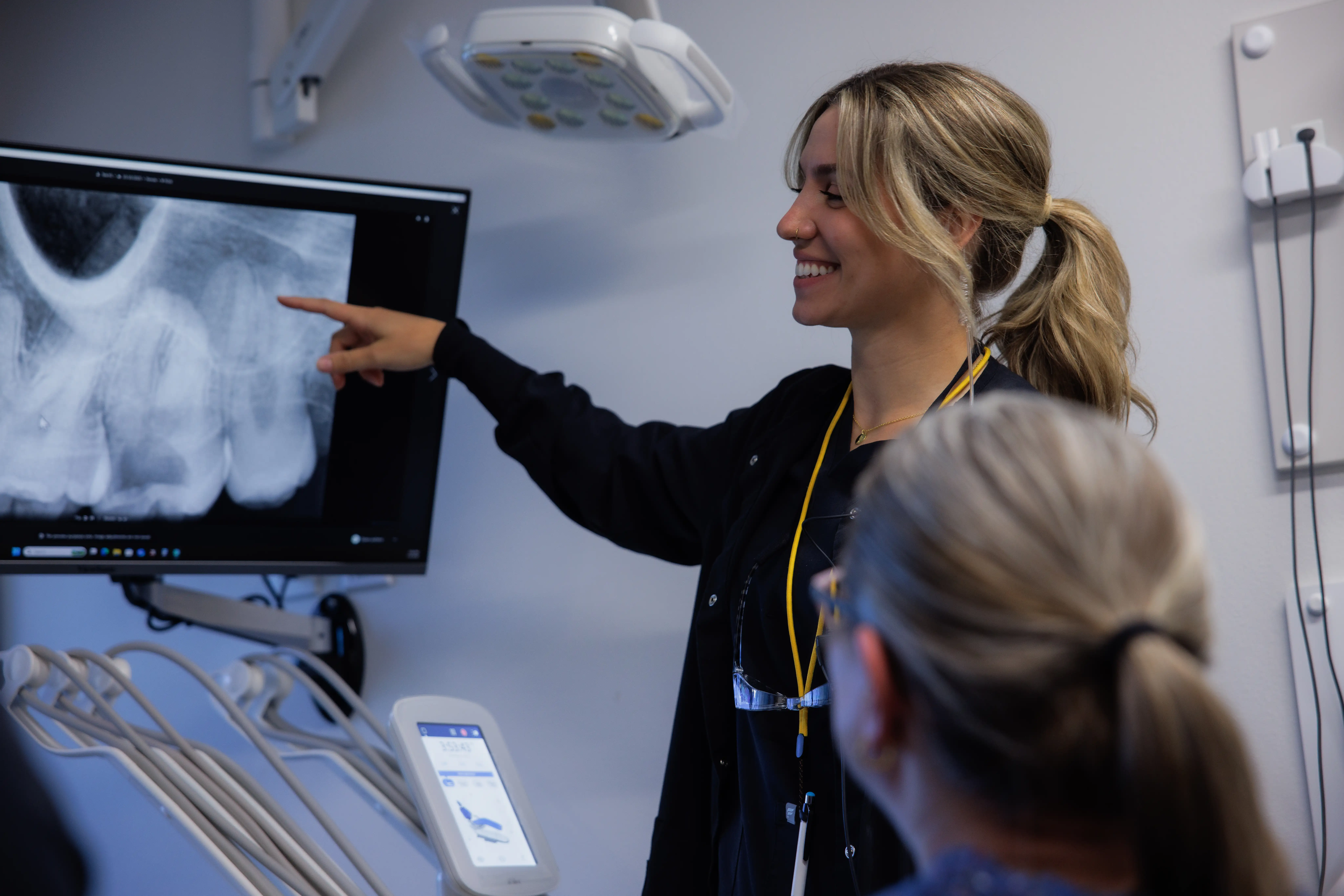 Springfield dental professional pointing at an X-ray with a dental patient