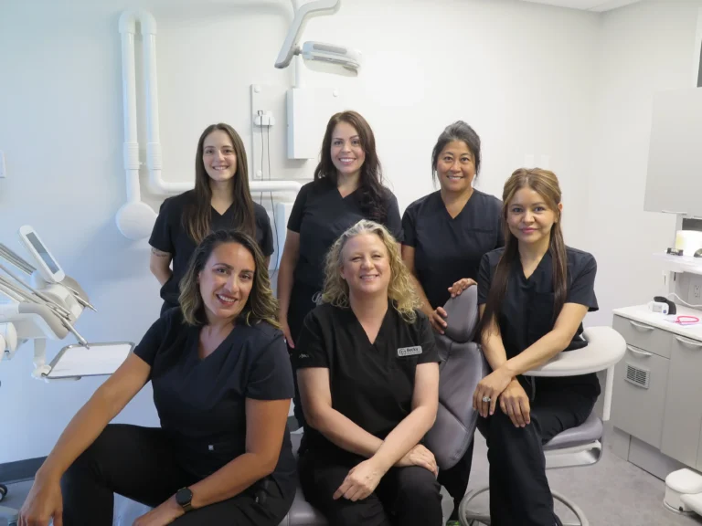 Springfield Dental Hygienists taking a group photo in McKenzie Dental Center’s operatory.